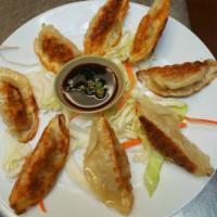 5. Dumplings · 8 pieces. Chicken vegetable dumpling, pan fried with sauce on the side.
