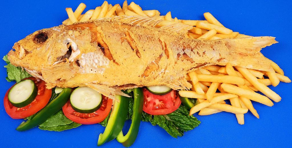 Whole Snapper Dinner · Whole snappers with fries and salad.
