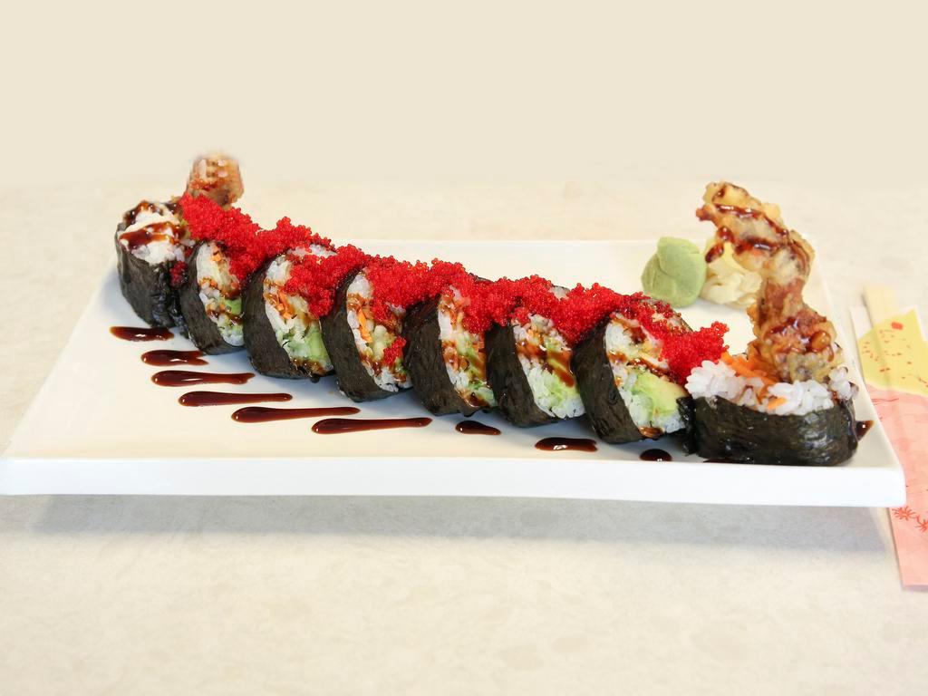 Amazing Spider-Roll · Fried softshell crab, crab mix, avocado, cucumber and carrots. Top: red tobiko. Sauces: sweet sauce.