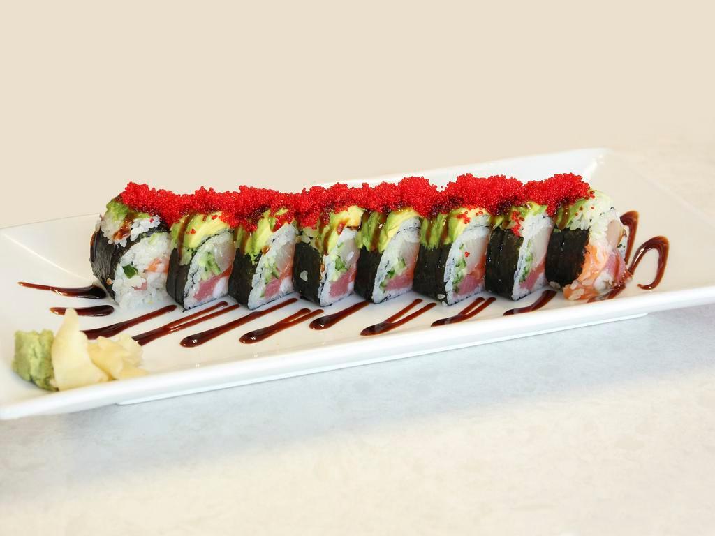 Sushi Manhunter · Ebi sushi, white tuna, salmon, tuna and cucumber. Top: avocado and red tobiko. Sauces: sweet sauce.