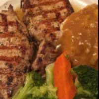 Broiled Pork Chop · Served with side.