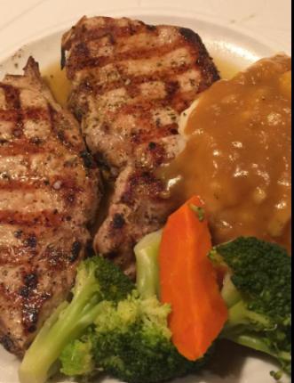 Broiled Pork Chop · Served with side.