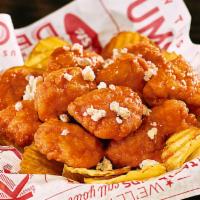 Wings · Red’s Bold all-white meat boneless wings—all served on
a bed of Yukon kettle chips.