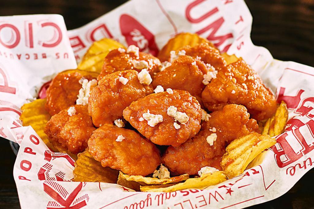 Wings · Red’s Bold all-white meat boneless wings—all served on
a bed of Yukon kettle chips.