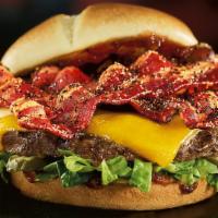 Smoke & Pepper™ Burger · Black-peppered bacon, extra-sharp Cheddar, shredded romaine, dill pickle planks, and Smoke &...