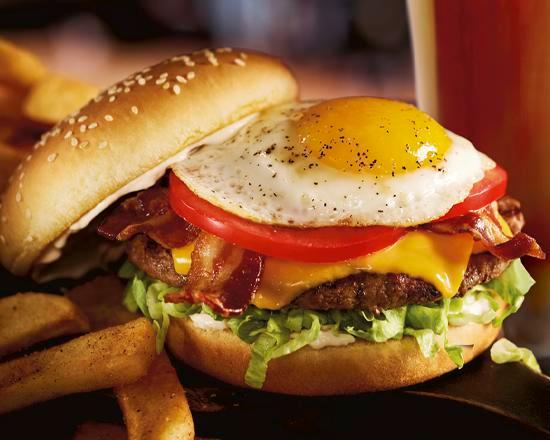 Royal Red Robin Burger · Hardwood-smoked bacon, egg♦,
American cheese, lettuce, tomatoes
and mayo.