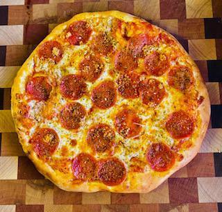 Woodstock Pepperoni Pizza · Red sauce, local cheese, pepperoni, garlic, oregano, extra virgin olive oil and herb blend.