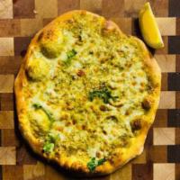 Green Garden Pesto Pizza · Basil citrus pesto, local cheese, fresh arugula, shaved Parmesan, garlic, extra virgin olive...