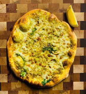 Green Garden Pesto Pizza · Basil citrus pesto, local cheese, fresh arugula, shaved Parmesan, garlic, extra virgin olive oil and herb blend.