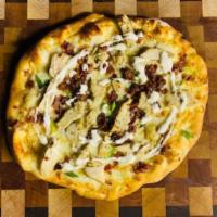 Cowgirl Pizza · Garlic sauce, local cheese, seasoned chicken, bacon, green onion, extra virgin olive oil, he...