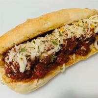 Meat A’ Ball Grinder · Smoked homemade meatballs and marinara served on a grilled hoagie, topped with Parmesan and ...