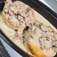 Biscuits and Gravy · 2 biscuits topped with sausage gravy, and 2 eggs made your way.