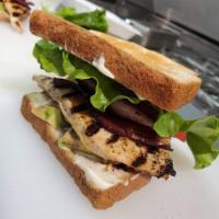 Chick BLT Sandwich · Grilled chicken breast topped with bacon, lettuce, tomato, avocado, and garlic aioli, on you...