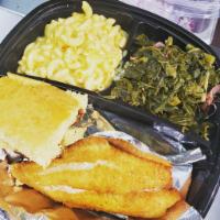 Catfish Dinner · 2 pc fried catfish served with mixed greens w/ turkey, mac/cheese and cornbread.