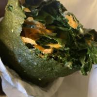 Raw Vegan Wrap · Fully loaded kale with spinach and cucumber prepared in a 100% natural wrap.