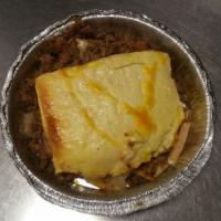 Baked Moussaka · Layers of eggplant, zucchini, ground beef and sliced potato topped with bechamel sauce, serv...