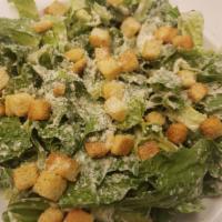 Caesar Salad · Chopped romaine, Parmesan cheese, croutons, and tossed in Caesar dressing.