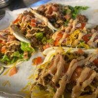 Beef Tacos (3) · Lettuce, pico de gallo, shredded cheese, and chipotle aioli.