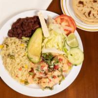 Camarones a La Crema · Shrimp cooked in heavy cream served with salad avocado, cheese lemon, rice beans and tortill...
