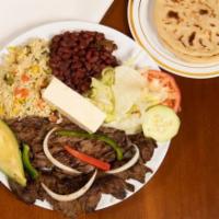 Carne Asada · Grilled beef steak served with salad, avocado, cheese, lemon rice, beans and tortilla.
