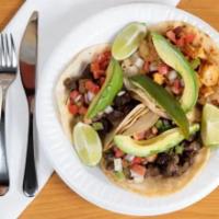 Mexican Tacos (Soft Tacos) · Popular Mexican food served on soft tortilla with choice of meat along with pico de Gallo, c...