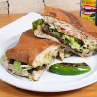 Tortas Mexicanas · Served on special Mexican bread with re fried beans along your choice of meat - chicken or b...