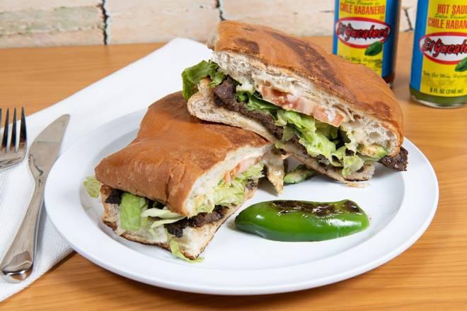 Tortas Mexicanas · Served on special Mexican bread with re fried beans along your choice of meat - chicken or beef -come with lettuce, tomato, mayonnaise, jalapeno, and guacamole.
