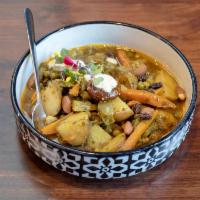 Vegetarian Tagine · Artichoke hearts, summer squash, carrots, green peas and harissa-yogurt.