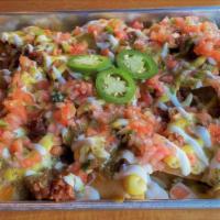 Nachos · Seven-Pepper Chili, shredded Cheddar, Cheddar cheese sauce, sour cream, salsa verde, pico de...