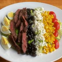 Southwest Steak Salad · Wood-grilled skirt steak, romaine, black beans, sweet corn, hard-boiled eggs, queso fresco, ...
