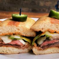 Steak Sandwich · Wood-grilled skirt steak, mozzarella, chipotle mayo, lettuce, tomatoes, grilled onions, gril...
