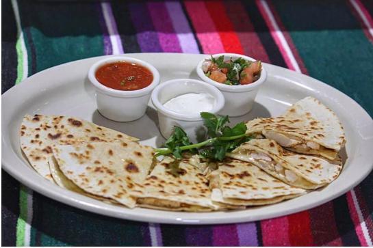 Quesadilla Santa Fe Appetizer · 2 flour tortillas grilled, filled with melted cheese and your choice of grilled chicken or steak, cut into pieces. Served with corn pico and sour cream.