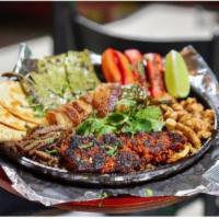 David’s Skillet  · Grilled steak, chicken, chorizo, bacon wrapped jalapeno, napal, Mexican Frank sausage and a ...
