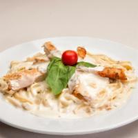 Chicken Alfredo Entree · Served with Alfredo sauce, a roll and Parmesan cheese. 