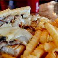 Papa G’s Beef Sandwich · Slices of roast beef, served on a French roll, topped with melted Swiss cheese, mushrooms, a...