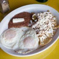 9. Chilaquiles Verde con Huevo · Green chilaquiles with over easy or scrambled eggs topped with sour cream and fresh cheese.