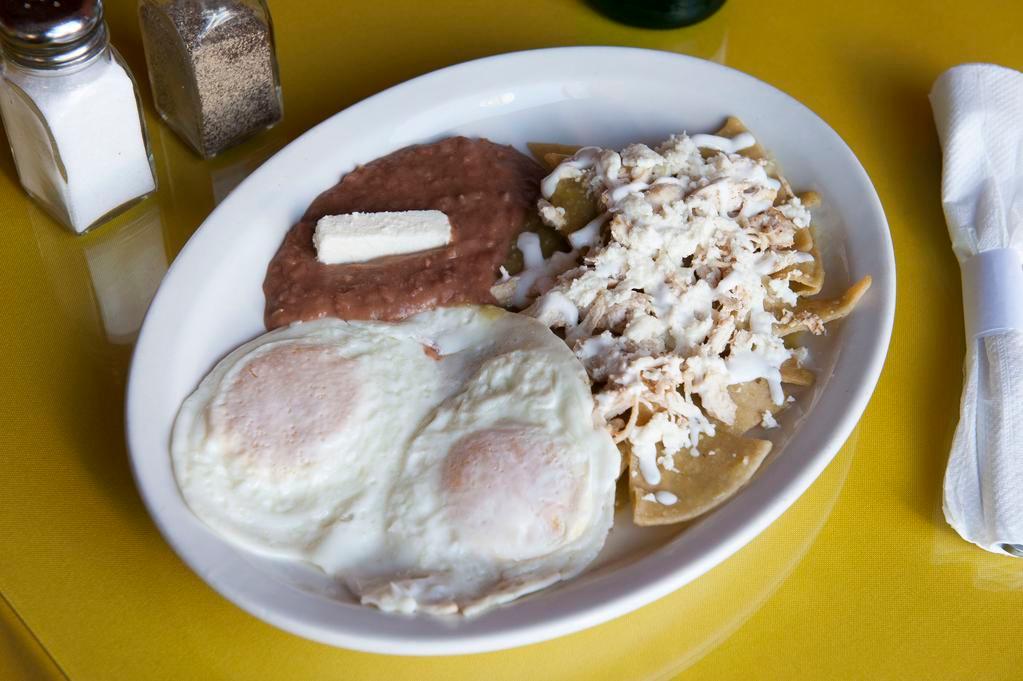 9. Chilaquiles Verde con Huevo · Green chilaquiles with over easy or scrambled eggs topped with sour cream and fresh cheese.