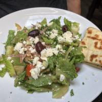 Small Greek Salad · Lettuce, tomatoes, cucumbers, onions, olives, feta cheese and dressed with olive oil.