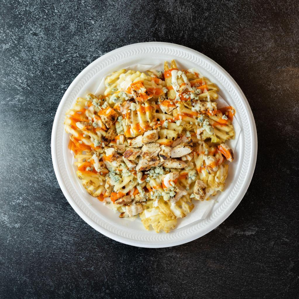 Buffalo Bleu Fries · Our factory fries topped with ranch dressing and buffalo sauce, grilled chicken breast and crumbled blue cheese