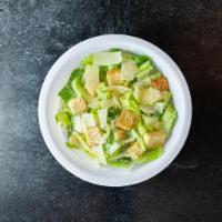 Caesar Salad · Hearts of romaine, Shaved Parmagiano Reggiano, garlic roasted croutons and Parmesan cheese. ...
