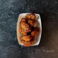 Boneless Wings · Gently marinated in house, slowly cooked for juicy tenderness and finished in the fryer for ...