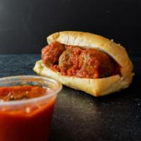 Meat Ball Sandwich · Three meatballs on french bread topped with marinara.