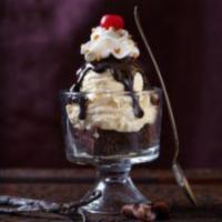 Classic Sundae · Sweet Cream ice cream, hot fudge, whipped cream, chopped peanuts, and cherry.