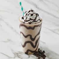 Coffee · Coffee ice cream topped with whipped cream and chocolate drizzle on top and the side of the ...