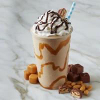 Snickers  · Sweet cream ice cream mixed with snickers topped with whipped cream and carmel drizzle on to...