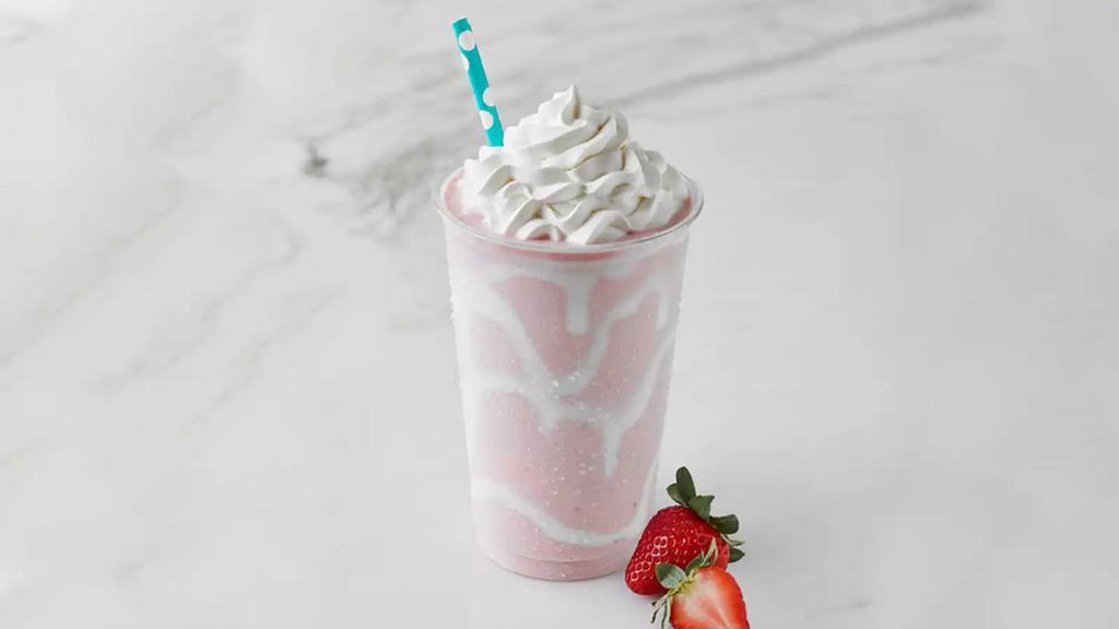Strawberry Shake · Strawberry Ice Cream topped with Whipped Cream and drizzle of Marshmallow Topping on the side of the cup.