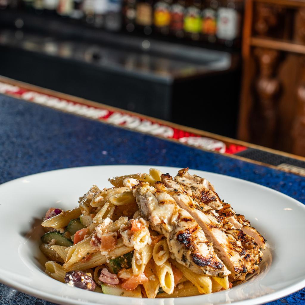 Chicken Pasta · Grilled marinated chicken breast over chilled penne pasta, feta cheese, Kalamata olives, red onions, tomatoes, cucumbers, pepperoncini's tossed in a sun dried tomato vinaigrette.