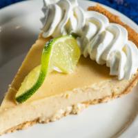 Key Lime Pie · House made key lime pie in a graham cracker crust.  Topped w/whipped cream.