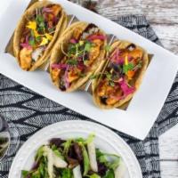 Pollo Tacos · 3 tacos with grilled chicken breast, mole, white rice, red onion, and cilantro. Served with ...