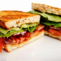 Traditional BLT Sandwich · Smoked bacon on toasted sliced sourdough with mayo, mustard, lettuce, tomato.